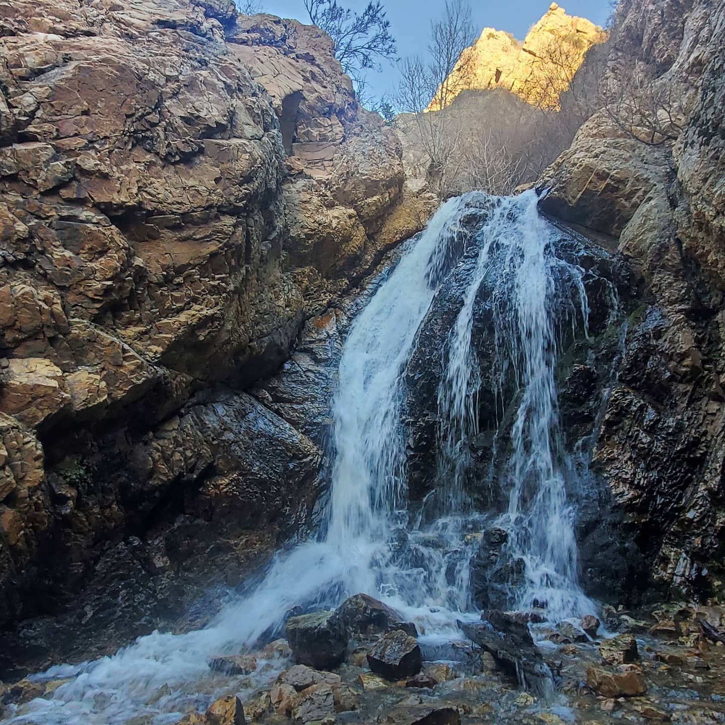 A canyon waterfall running hard through the spring melt